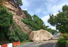 Sandakan village road blocked by massive boulder after landslide
